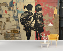 Load image into Gallery viewer, Urban Brick Graffiti Wall Mural – 3D Street Art Wallpaper Featuring Two Girls Holding Hands – Bold Textured Modern Decor – Banksy-Style
