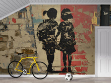 Load image into Gallery viewer, Urban Brick Graffiti Wall Mural – 3D Street Art Wallpaper Featuring Two Girls Holding Hands – Bold Textured Modern Decor – Banksy-Style