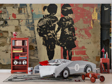 Load image into Gallery viewer, Urban Brick Graffiti Wall Mural – 3D Street Art Wallpaper Featuring Two Girls Holding Hands – Bold Textured Modern Decor – Banksy-Style