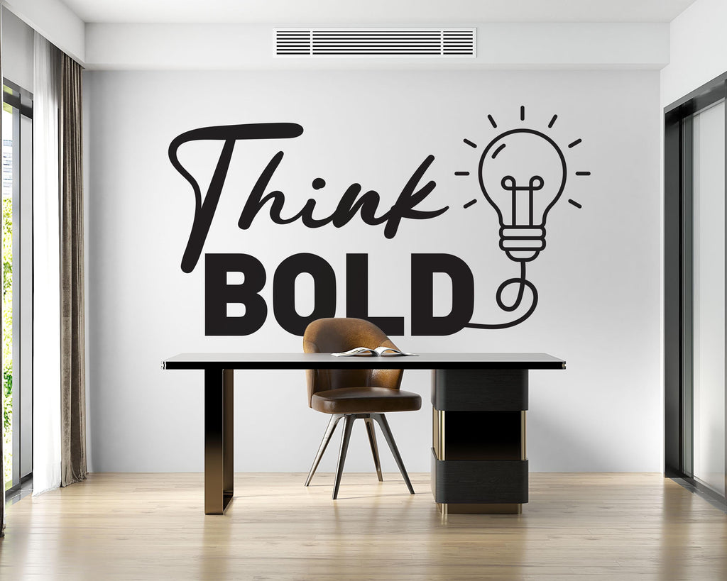 May include: A modern office space featuring a black desk with gold accents, a brown leather chair, and the words "Think BOLD" with a lightbulb graphic on the wall. The room has a minimalist design with natural light.