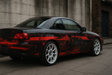 Load image into Gallery viewer, Red Distressed Street Wrap – Matte Black &amp; Crimson Vinyl | Grunge Brush Texture Car Design | Custom Urban Performance Wrap by Stickalz nv099